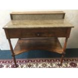 A nineteenth century mahogany washstand, with raised shelf to back above a rectangular marble top