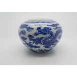 A Chinese blue & white jar decorated with five-clawed dragons and clouds beneath greek key band -