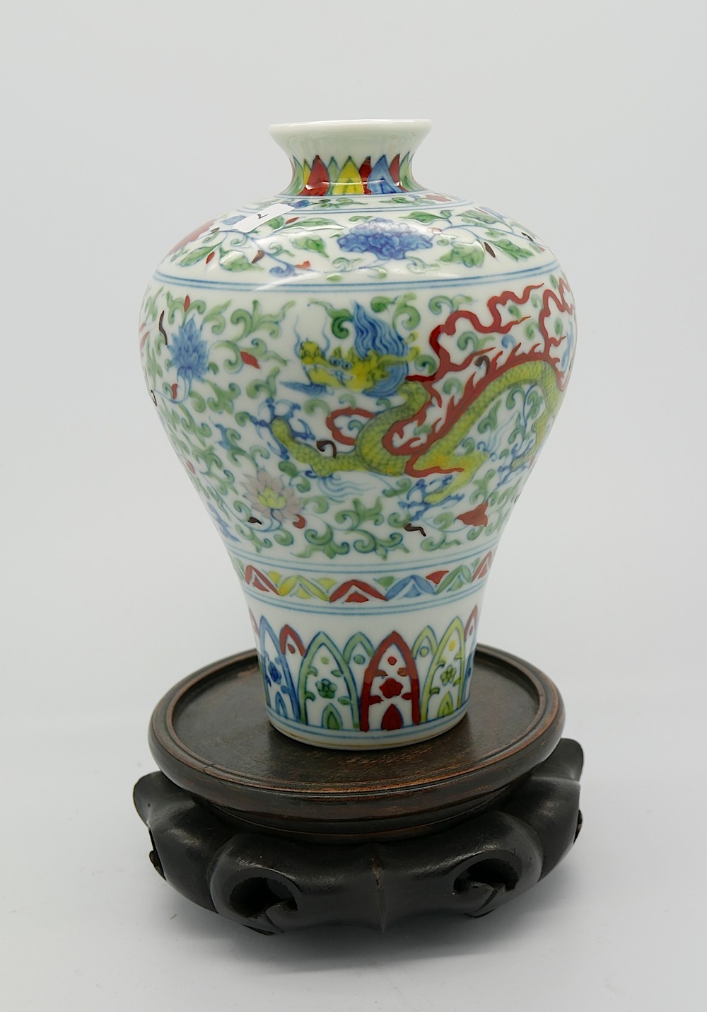 A Chinese doucai glazed vase of bulbous tapering form decorated with dragon and phoenix to body