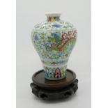 A Chinese doucai glazed vase of bulbous tapering form decorated with dragon and phoenix to body
