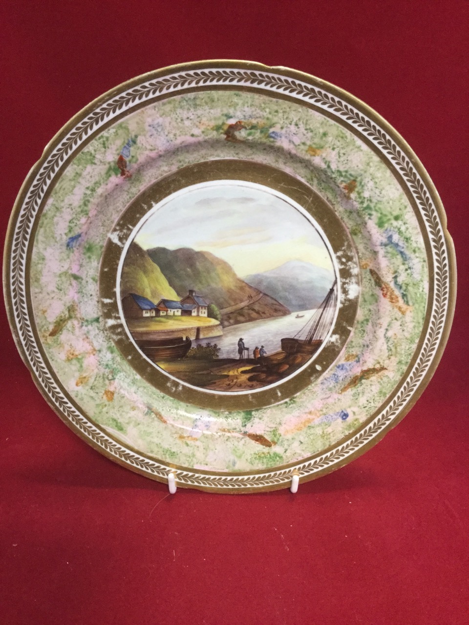 A nineteenth century Irish porcelain plate handpainted with scene of Barmouth harbour in