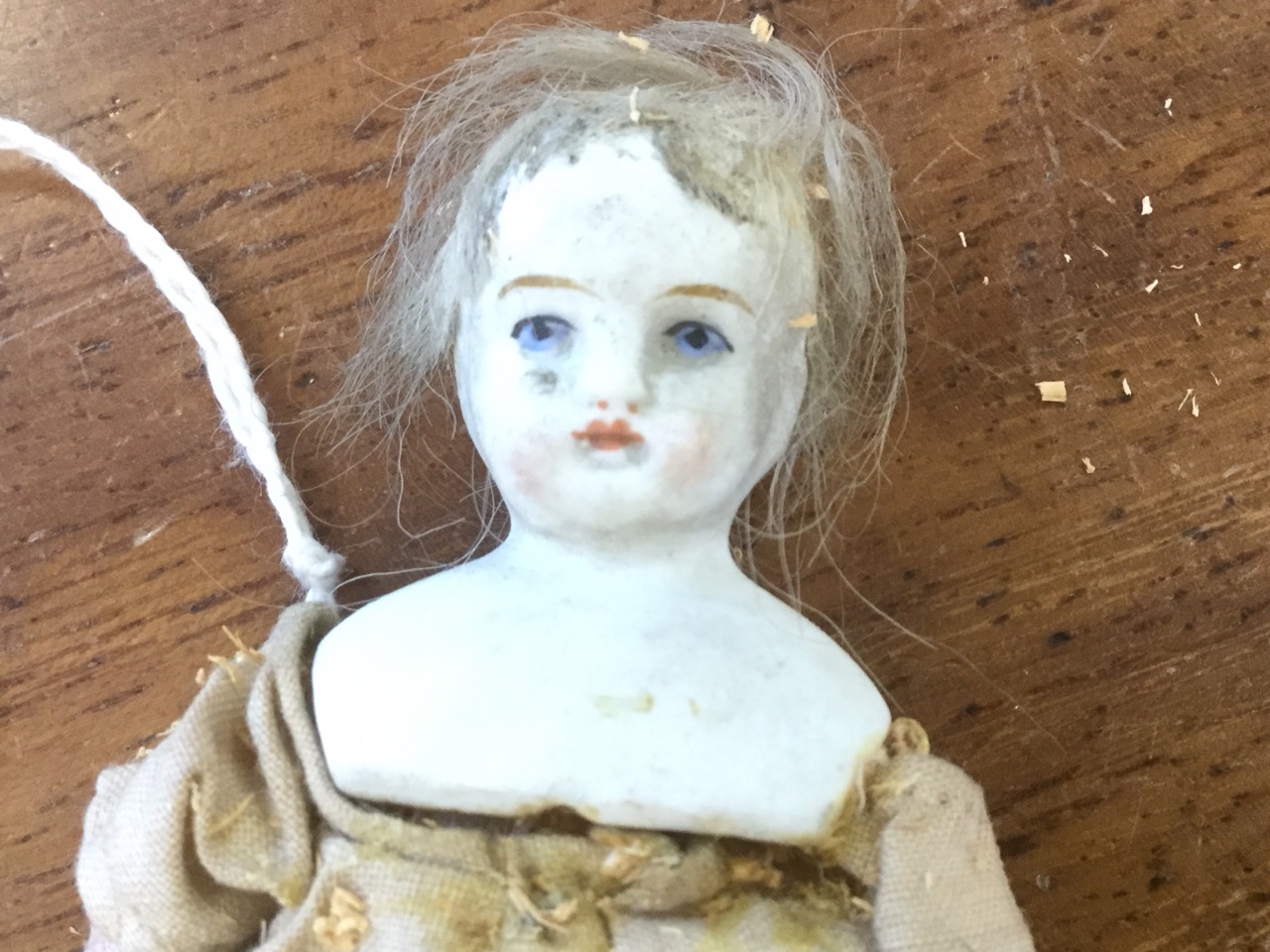 An early nineteenth century doll, with hand-painted porcelain head on sawdust stuffed body, - Image 2 of 3