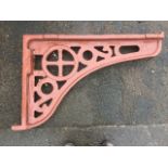 A Victorian cast iron roof bracket from Akeld Station, with pierced decoration to spandrel. (33in