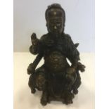 A Chinese bronze figure of a bearded seated gentleman, wearing traditional robes and headdress,