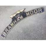 A brass engine nameplate The Bramham Moor, the arched panel beneath a running fox. (47in)