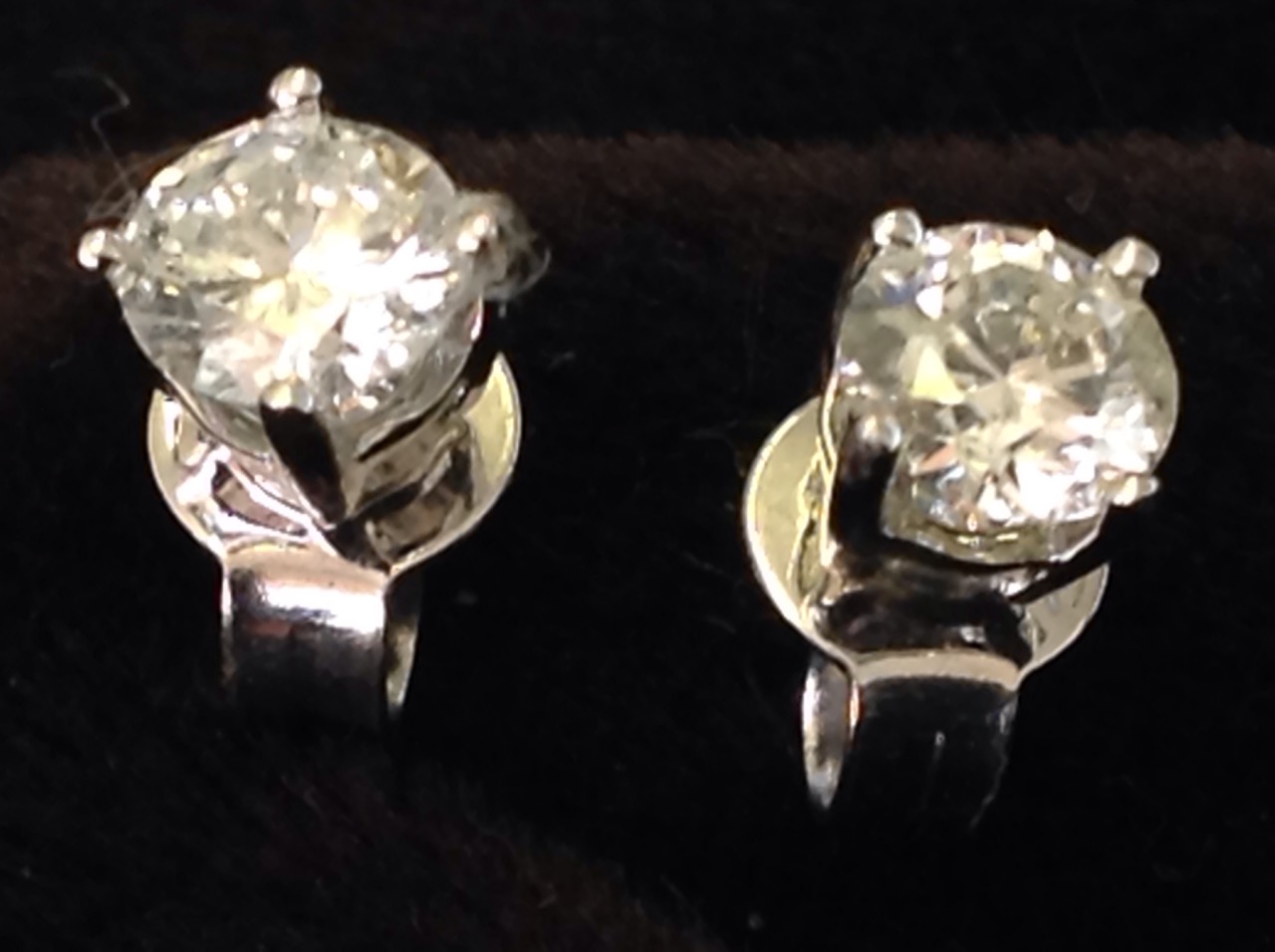 A pair of 18ct white gold diamond stud earrings, the fine claw set stones weighing over half a - Image 2 of 3