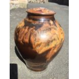 Robin Hopper (Canadian), a studio pottery jar & cover decorated with brown running glazes, with flat