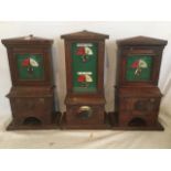 Three NER mahogany cased line block signalling instruments, the cabinets with glazed dials on