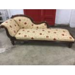 A Victorian mahogany chaise longue, with moulded acanthus carved frame and scrolled rest, having