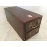 A LNER mahogany cased till box, with two drawers mounted with brass handles, the bottom drawer
