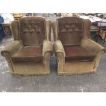 A pair of upholstered wing-back armchairs, having loose cushions and sprung bases, raised on