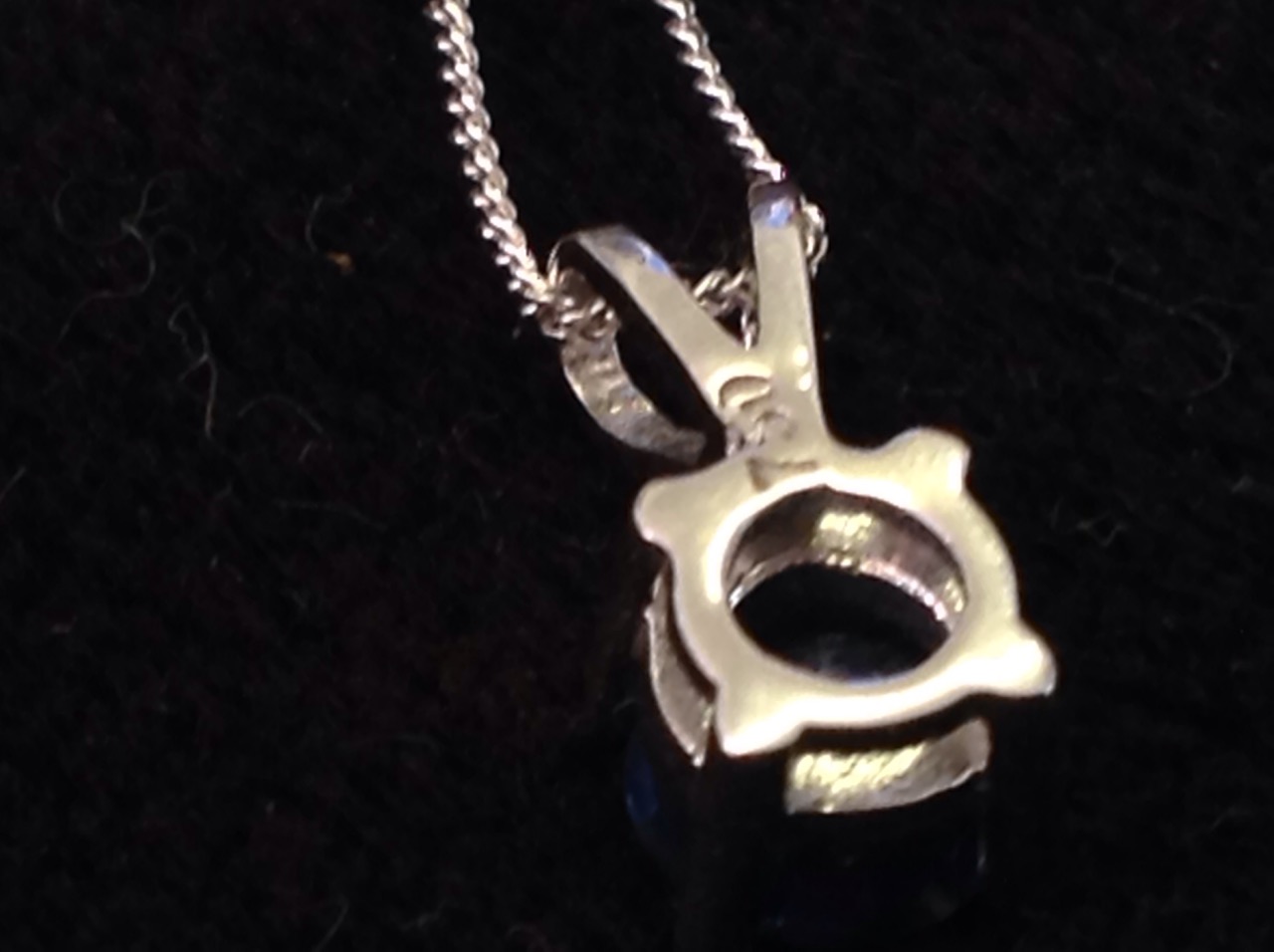 An 18ct white gold single stone sapphire pendant, the claw set stone on a fine chain weighing - Image 3 of 3