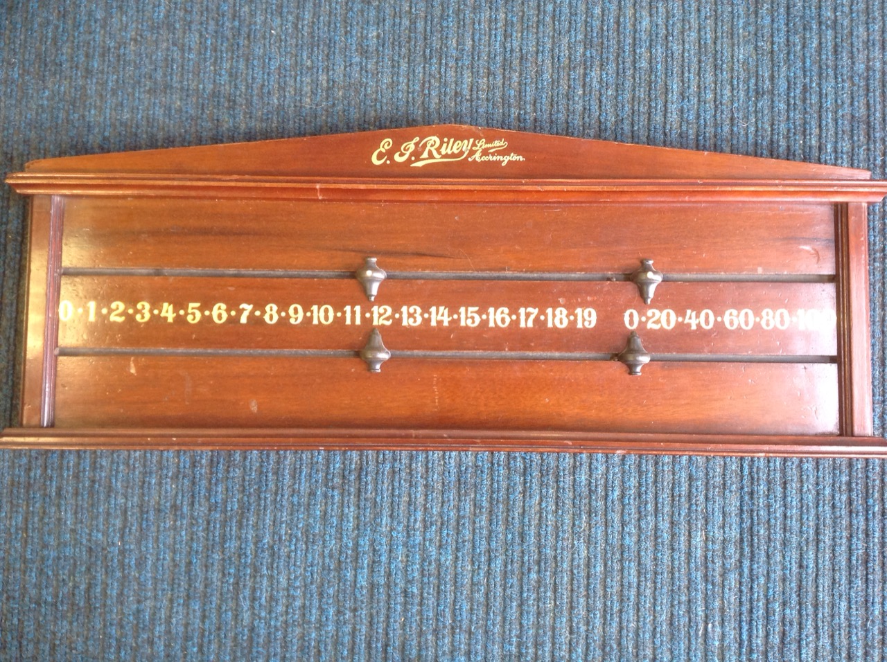 A Riley mahogany snooker scoreboard, having gilt numbers and ebony sliding pointers, raised on