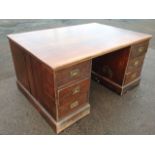 An Edwardian mahogany partners desk by Sopwith, the rectangular top supported on pedestals each