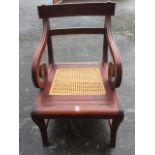A mahogany metamorphic library chair, with bar back and fluted scrolled arms above a removable