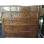 A Victorian mahogany chest of drawers, the rounded moulded top above two short and four long