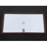 A mahogany framed carriage mirror, the rectangular plate marked with central BR logo. (21in)