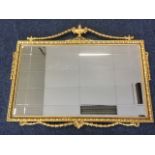 A gilded Adams style mirror, the rectangular bevelled plate in an egg & dart moulded frame