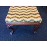 A George style mahogany stool, having a rectangular upholstered seat above cushion moulded apron,