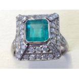 A square emerald & diamond pyramid shaped ring, the Columbian emerald of over 1.5 carats, framed