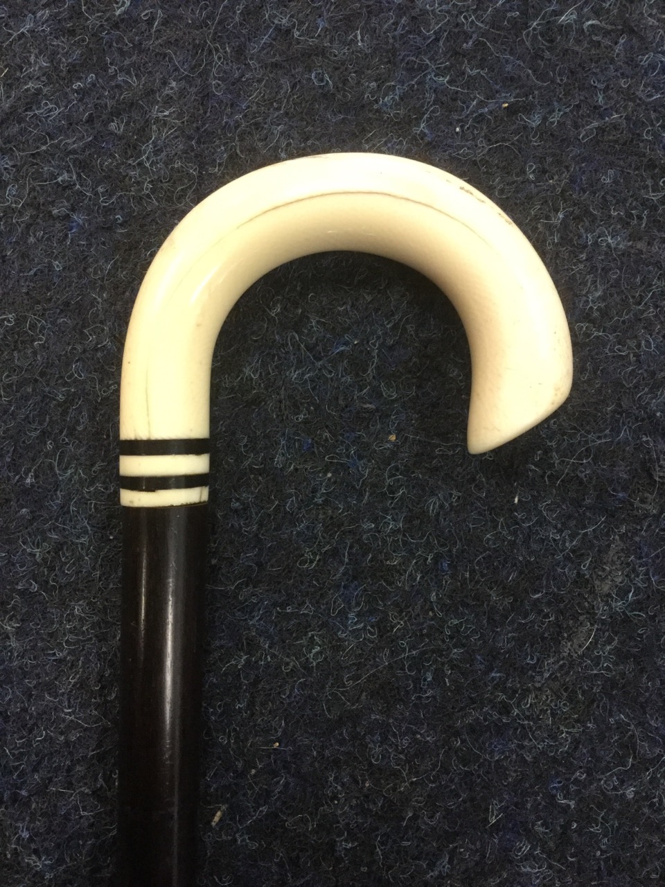 A Victorian mahogany walking stick with ivory handle, the tapering cane set with two ebony bands. ( - Image 3 of 3