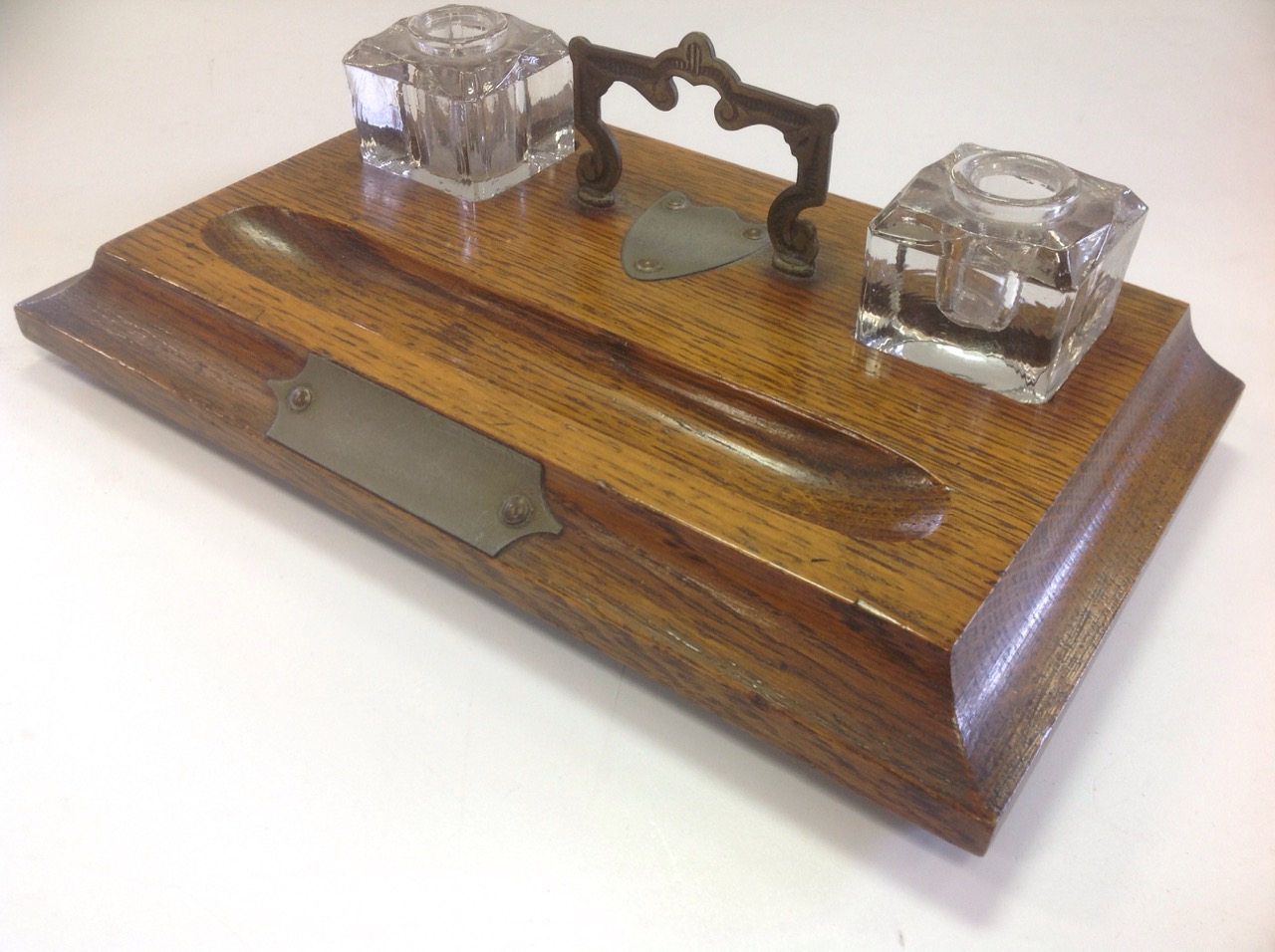 An Edwardian oak desk tidy, the moulded rectangular stand on bun feet, fitted with twin glass - Image 2 of 3