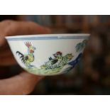 A Chinese doucai chicken cup decorated with a naive rooster & hen with their young chicks in