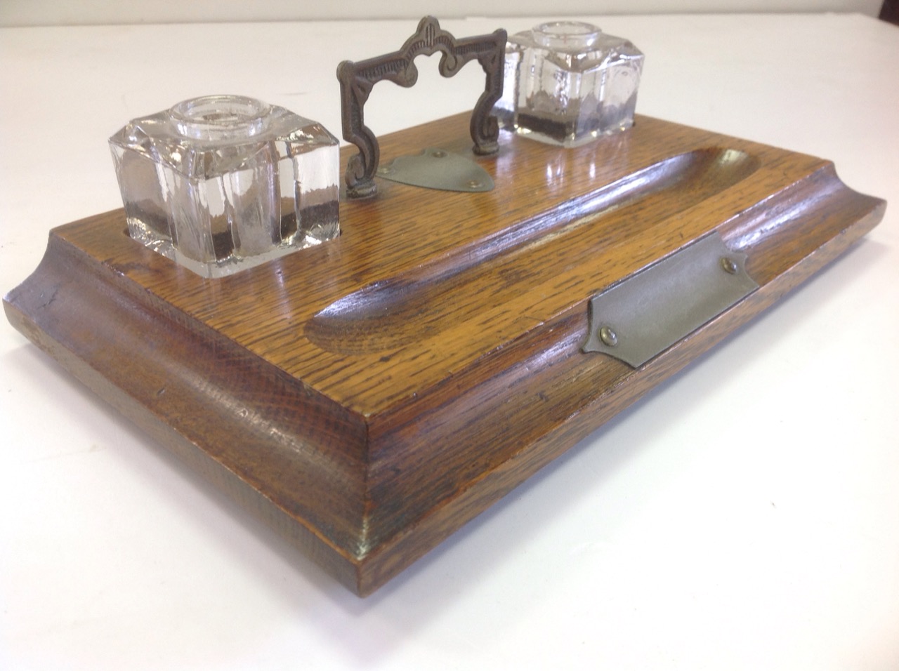 An Edwardian oak desk tidy, the moulded rectangular stand on bun feet, fitted with twin glass - Image 3 of 3