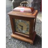 A walnut cased Georgian style mantle clock by Thwaites & Reed of London, with silvered chapter