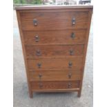 An oak chest of drawers, having rectangular moulded top above six drawers mounted with drop handles,