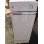 A Classic ISE kitchen in-sink-erator, the waste disposal unit freestanding with hinged door.