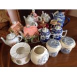 A collection of novelty teapots - floral, blue & white, etc; a pair of Ringtons willow pattern