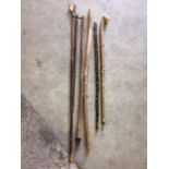 Six walking sticks - one having carved hand thumbpiece. (6)