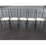 A set of five green metal dining chairs, having tapering backs above rush seats, supported on