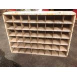 A metal cabinet containing 48 pigeonholes.