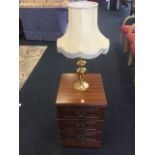 A large brass tablelamp, with candle mount on baluster column, fitted with octagonal shade; and a