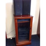 A mahogany hi-fi cabinet, having moulded lifting lid above a glazed door containing JVC record