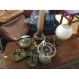 Two brass oil lamps; a pair of nineteenth century brass candle nightlights with rectangular trays,