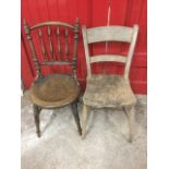 A Victorian kitchen chair with spindle back above circular pierced seat, raised on turned legs &