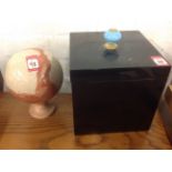 A polished marble ball on stand; and a black lacquered square lined box mounted with turquoise