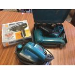 A Makita planer; a Black & Decker hammer drill; and a cased Makita cordless drill with charger. (3)
