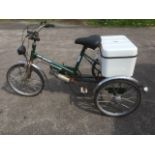 An electric tricycle, the Tri-pacer by TGA having lights, soft saddle, three gears, etc.