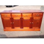 A hand-made mahogany sideboard by Karva, having rectangular moulded top above four frieze drawers,