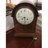 An Edwardian mahogany mantel clock, the domed case inlaid with boxwood & ebony stringing, having