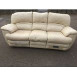 A Chateau Dax cream leather three-seater reclining sofa, having padded backs, arms & cushion seats.