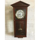 A mahogany cased Vienna style wallclock by Smallcombe, the enamelled dial with roman chapters and