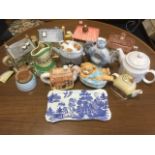 A collection of novelty teapots - houses, animals, Emmerdale, etc; a Maling willow pattern tray; a