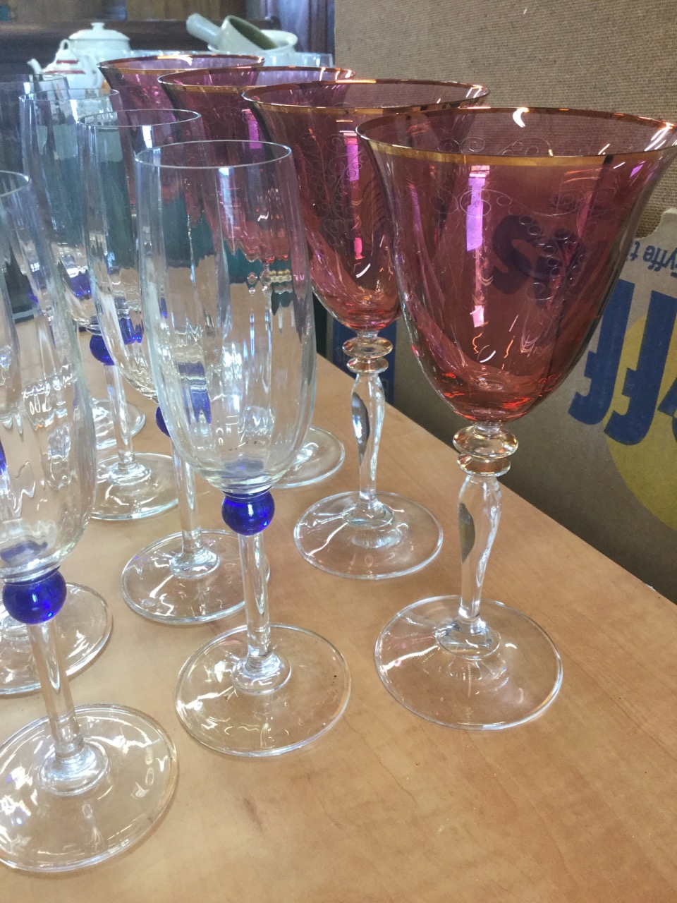 A set of nine champagne flutes on slender stems with blue bead decoration; and four large wine - Image 3 of 6