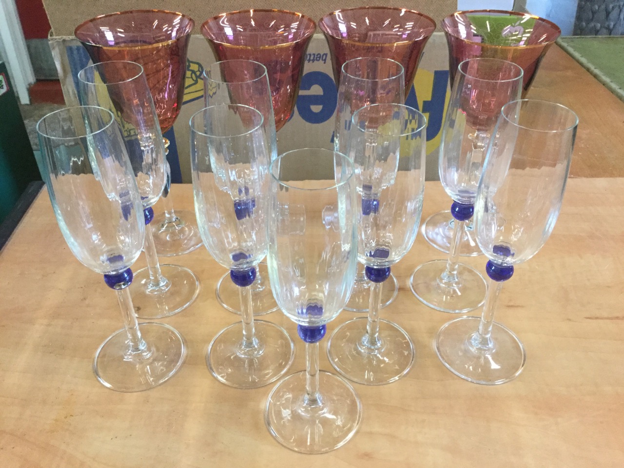 A set of nine champagne flutes on slender stems with blue bead decoration; and four large wine - Image 2 of 6