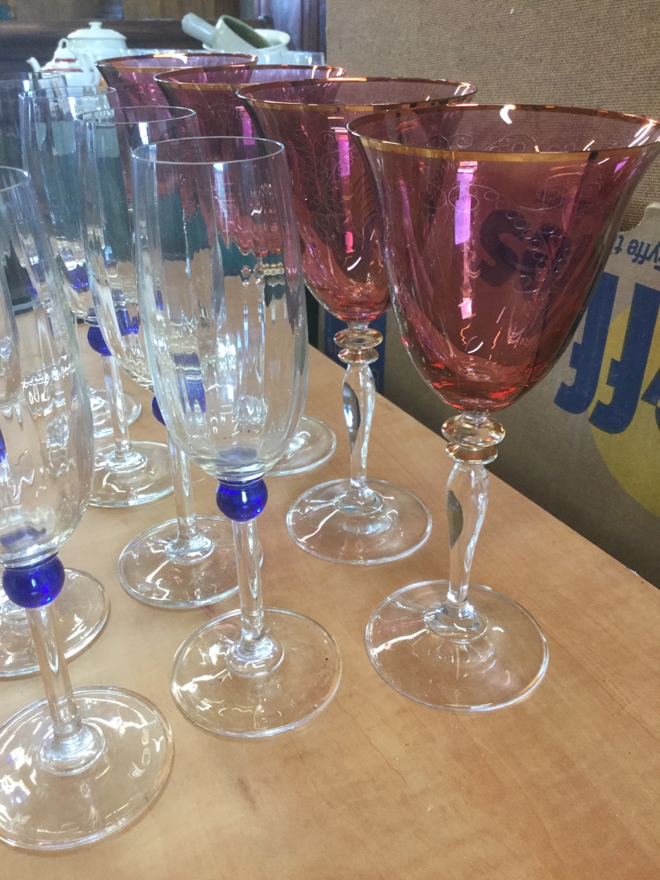 A set of nine champagne flutes on slender stems with blue bead decoration; and four large wine - Image 4 of 6